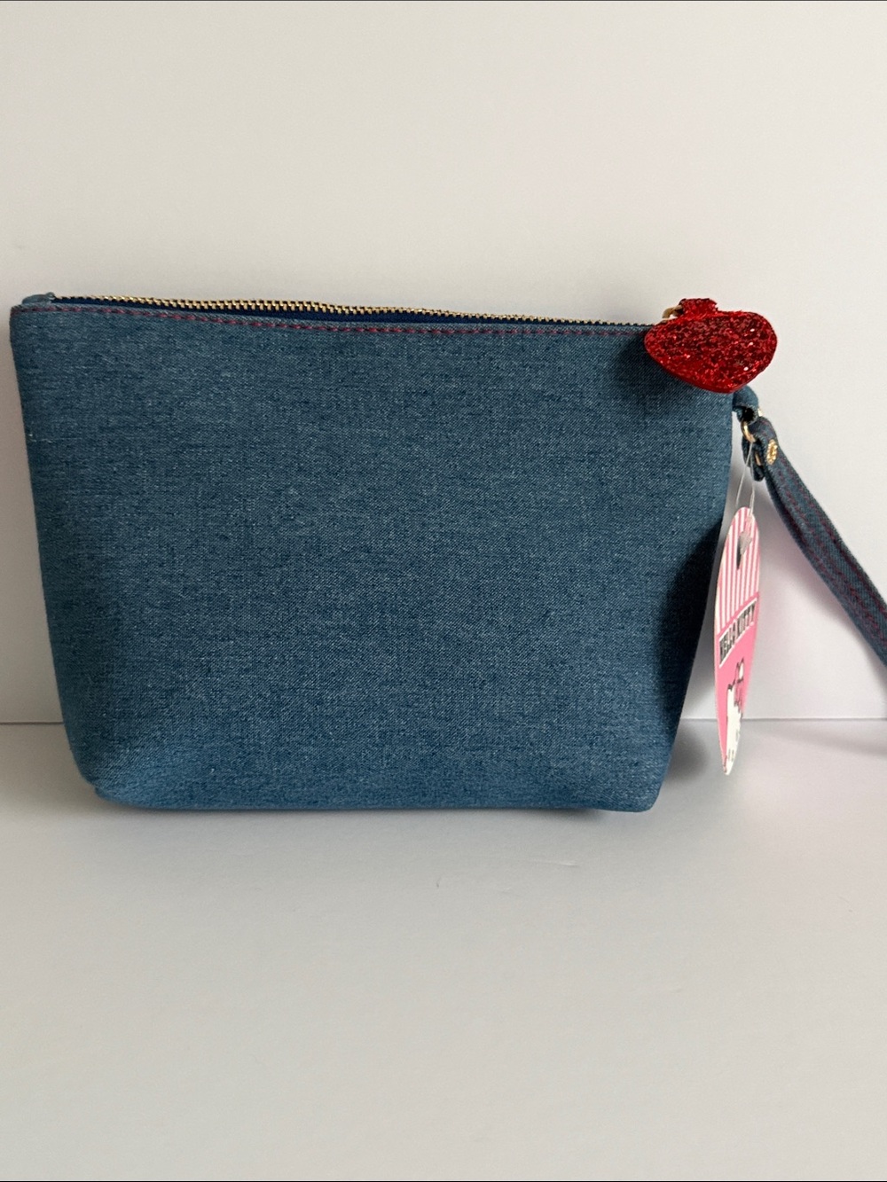 Blue denim pouch featuring embroidered Hello Kitty patches and a red satin bow - Picture 3 of 6